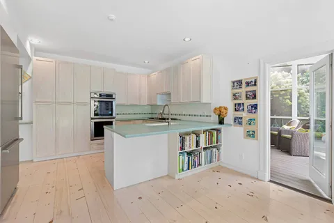 a kitchen with stainless steel appliances a refrigerator and a stove top oven