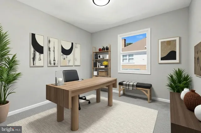 a view of a livingroom with furniture and a potted plant