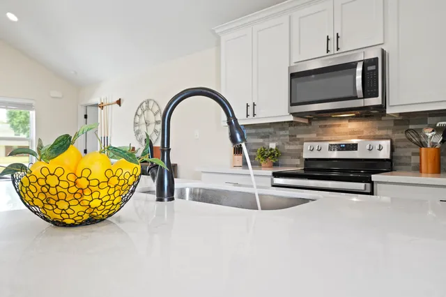 a kitchen with a stove and a microwave