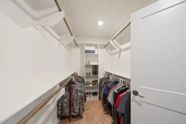 a bathroom with a double vanity sink mirror and shower