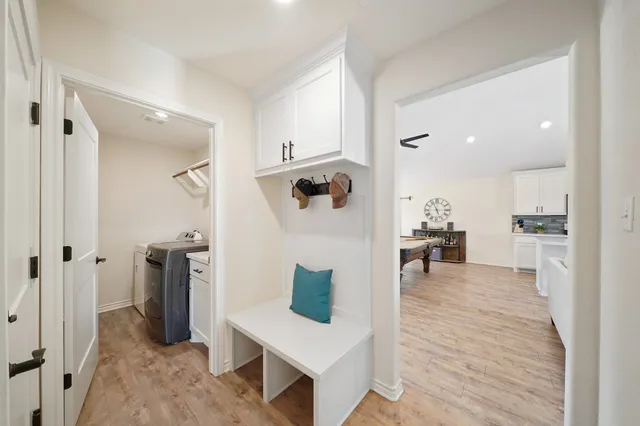 a view of walk in closet with clothes