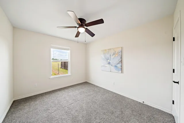 a bathroom with a sink a toilet a mirror and shower