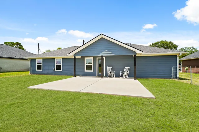 a view of a garden and swimming pool