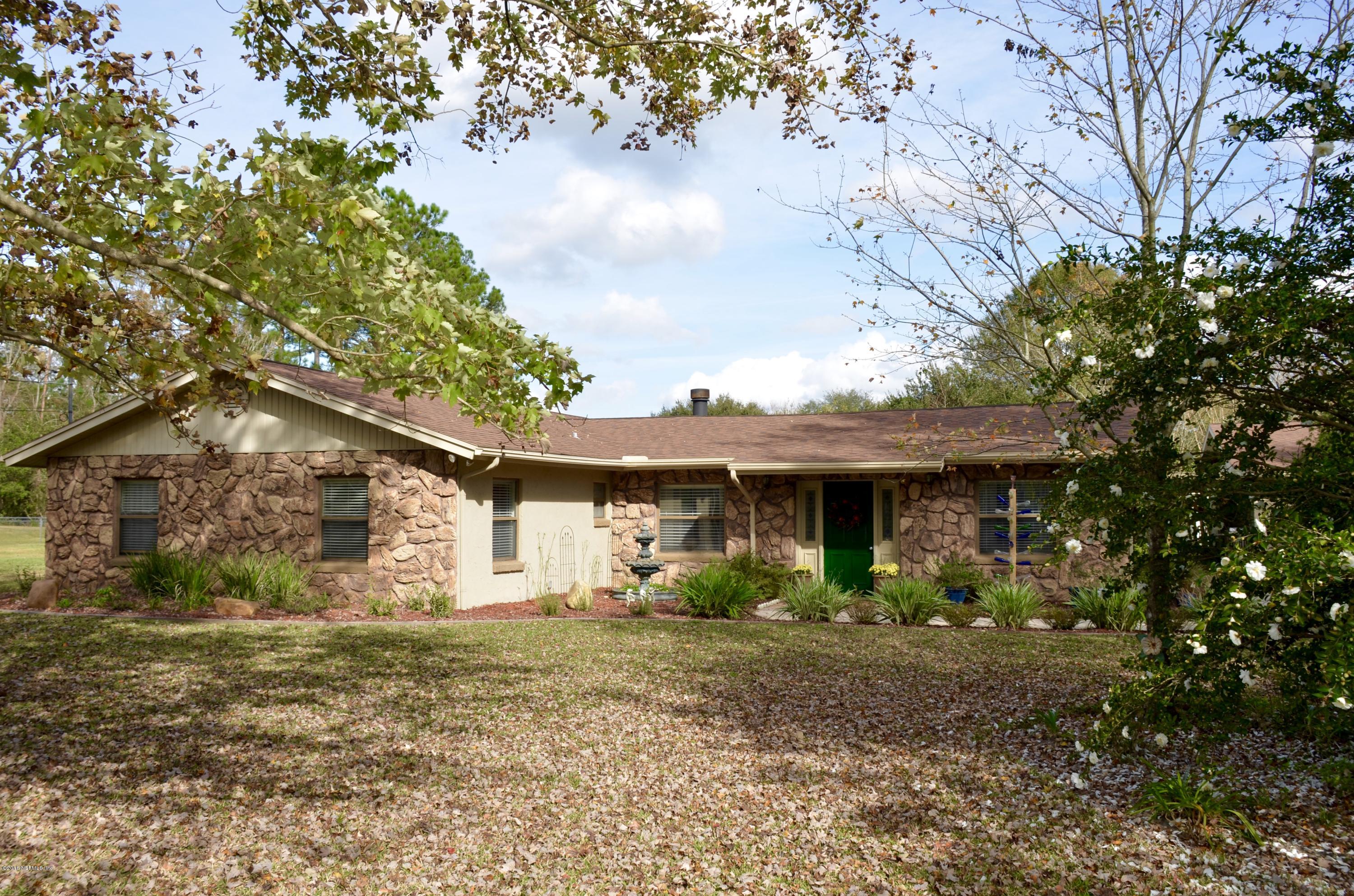 540516 Lem Turner Road Callahan, FL 32011 - Photo 1 of 26 a view of a house with yard and a tree