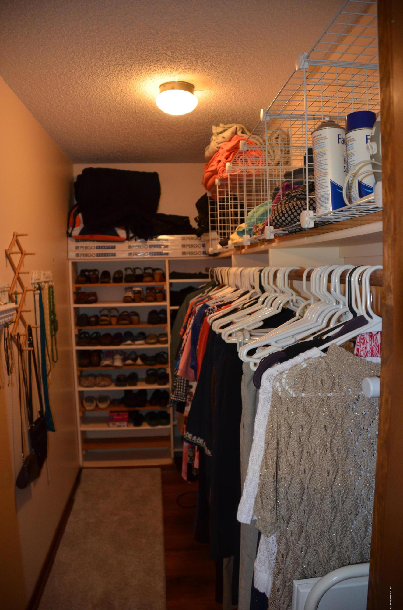 540516 Lem Turner Road Callahan, FL 32011 - Photo 17 of 26 a view of walk in closet with clothes and shoes