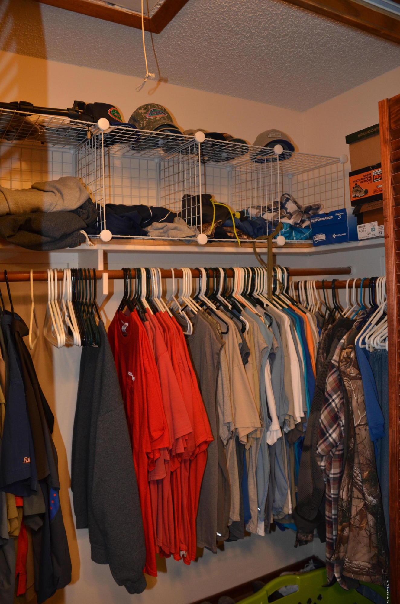 540516 Lem Turner Road Callahan, FL 32011 - Photo 18 of 26 a view of walk in closet with clothes and shoes