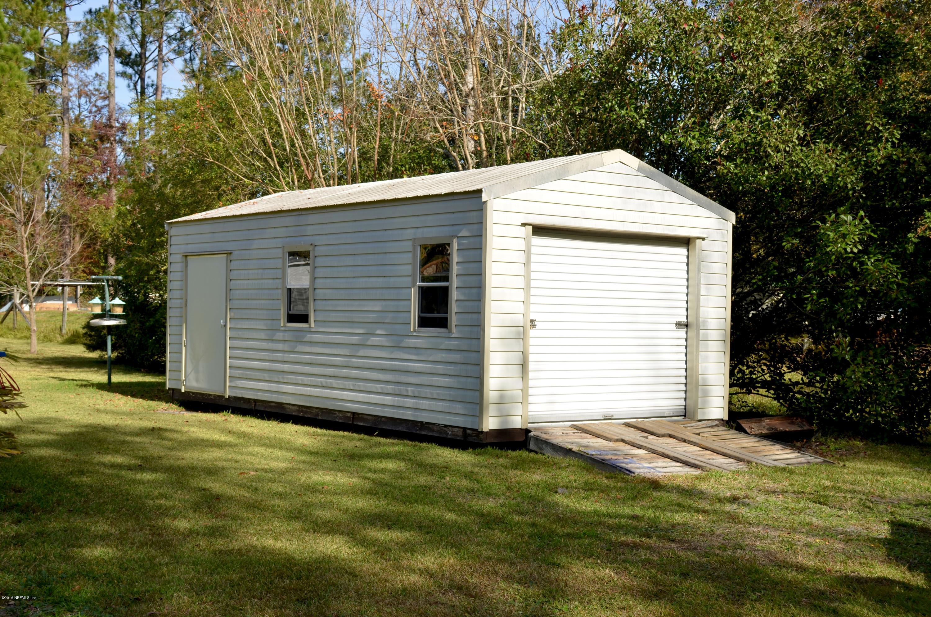 540516 Lem Turner Road Callahan, FL 32011 - Photo 22 of 26 a backyard of a house