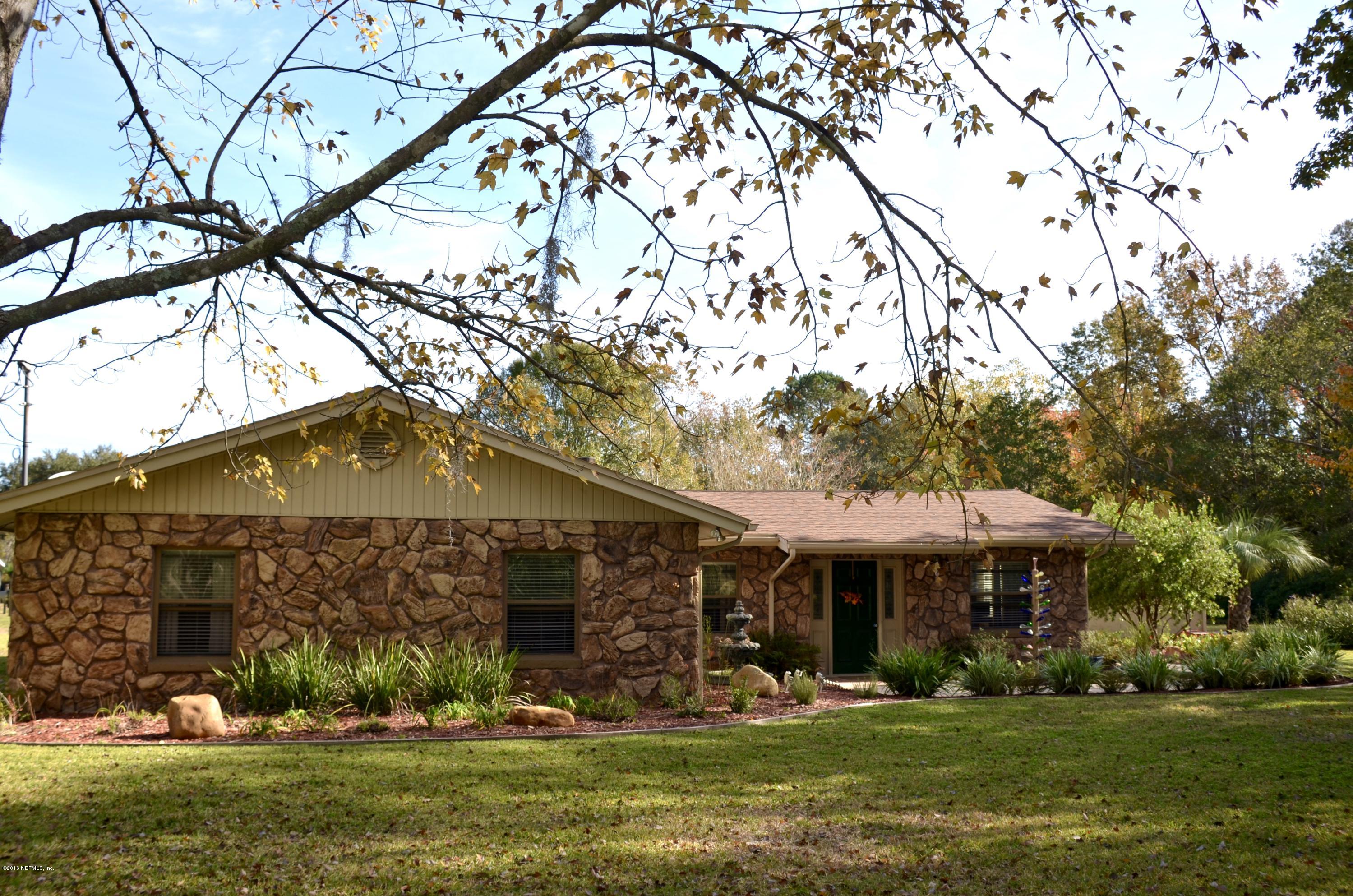 540516 Lem Turner Road Callahan, FL 32011 - Photo 3 of 26 a front view of a house with a yard