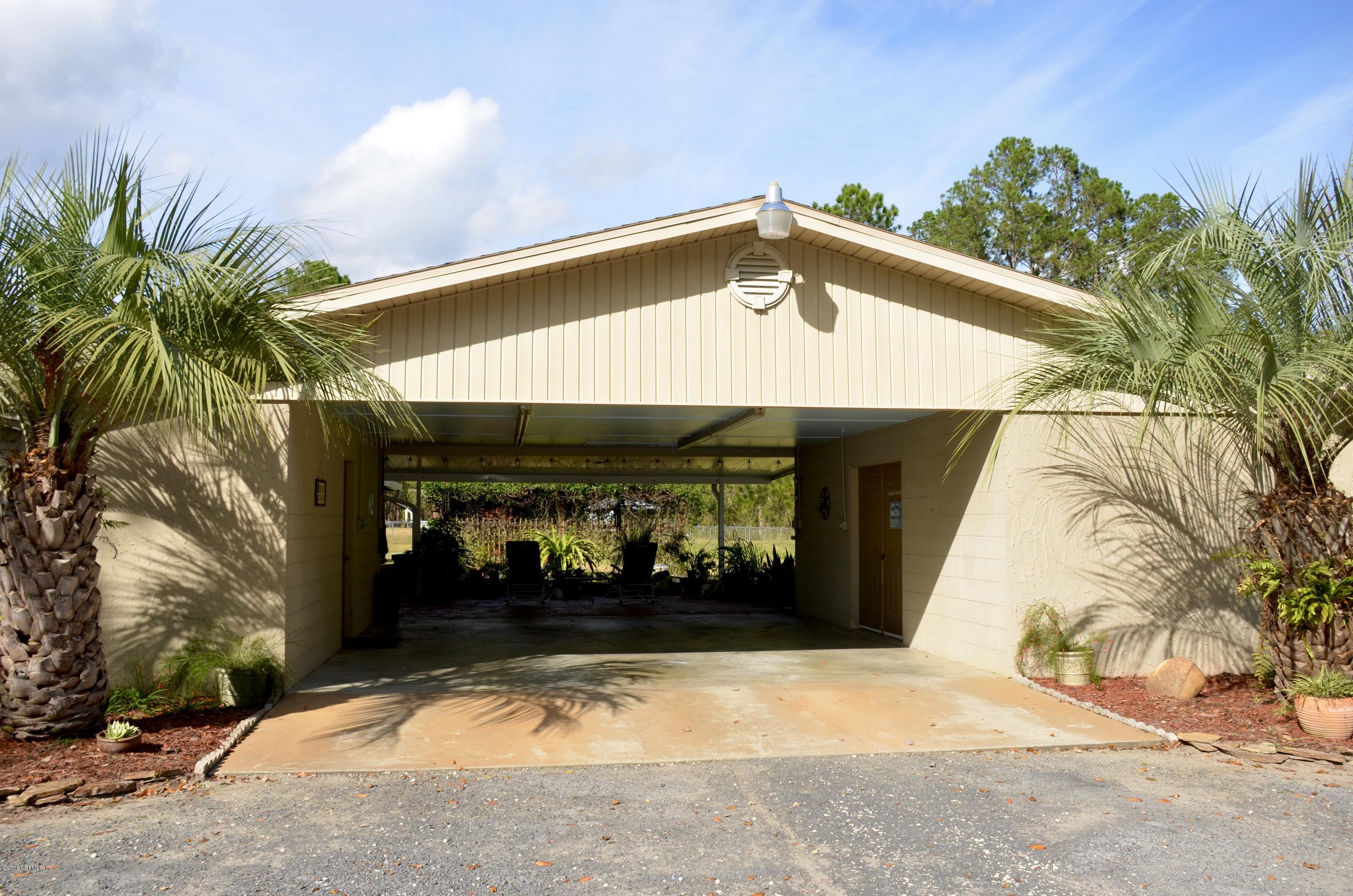 540516 Lem Turner Road Callahan, FL 32011 - Photo 6 of 26 a front view of a house with a yard