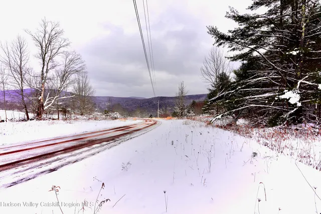 a view of a snow on the road