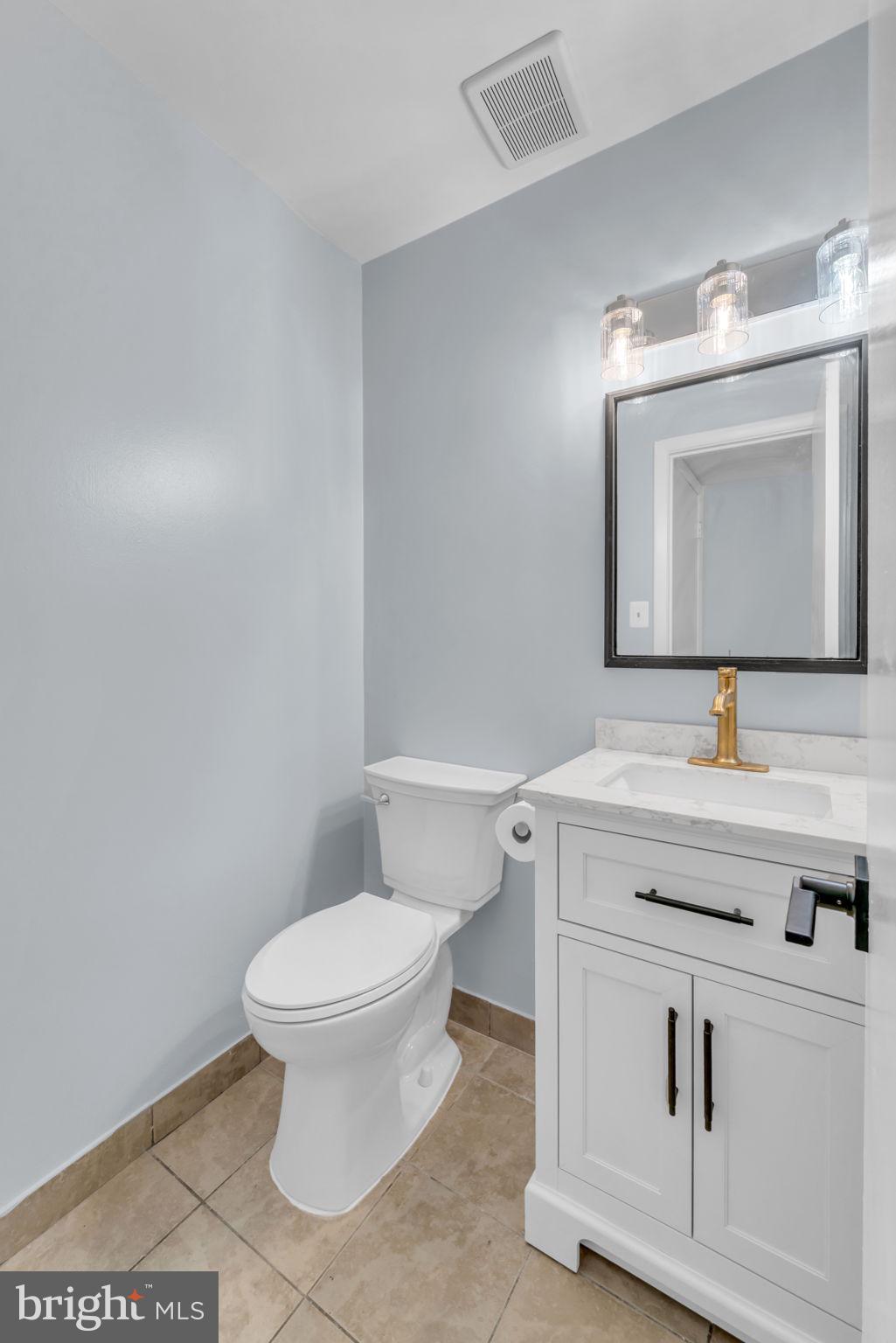 13314 Apgar Place Herndon, VA 20170 - Photo 11 of 39 a bathroom with a toilet sink and mirror