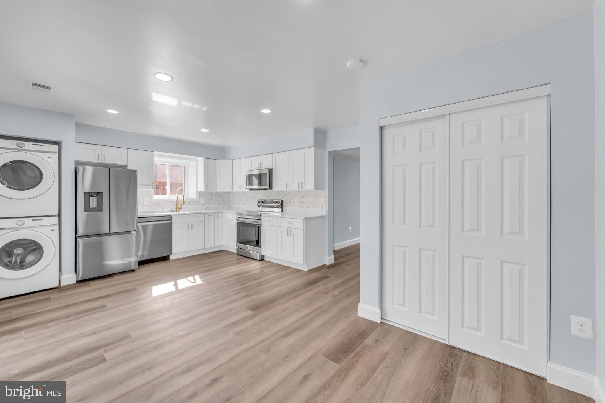13314 Apgar Place Herndon, VA 20170 - Photo 13 of 39 a view of a kitchen with refrigerator and microwave
