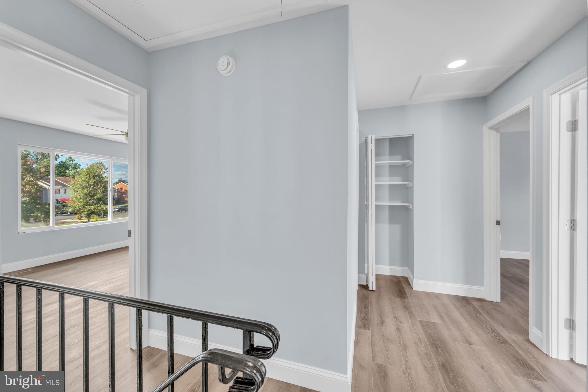 13314 Apgar Place Herndon, VA 20170 - Photo 18 of 39 a view of a hallway with wooden floor and a window