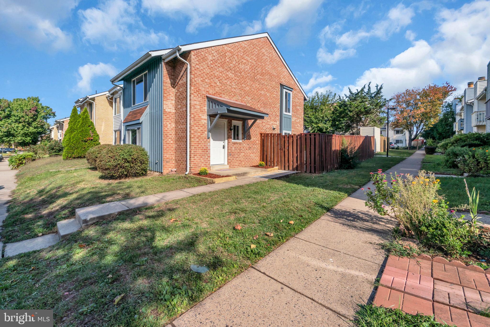 13314 Apgar Place Herndon, VA 20170 - Photo 2 of 39 a front view of a house with garden