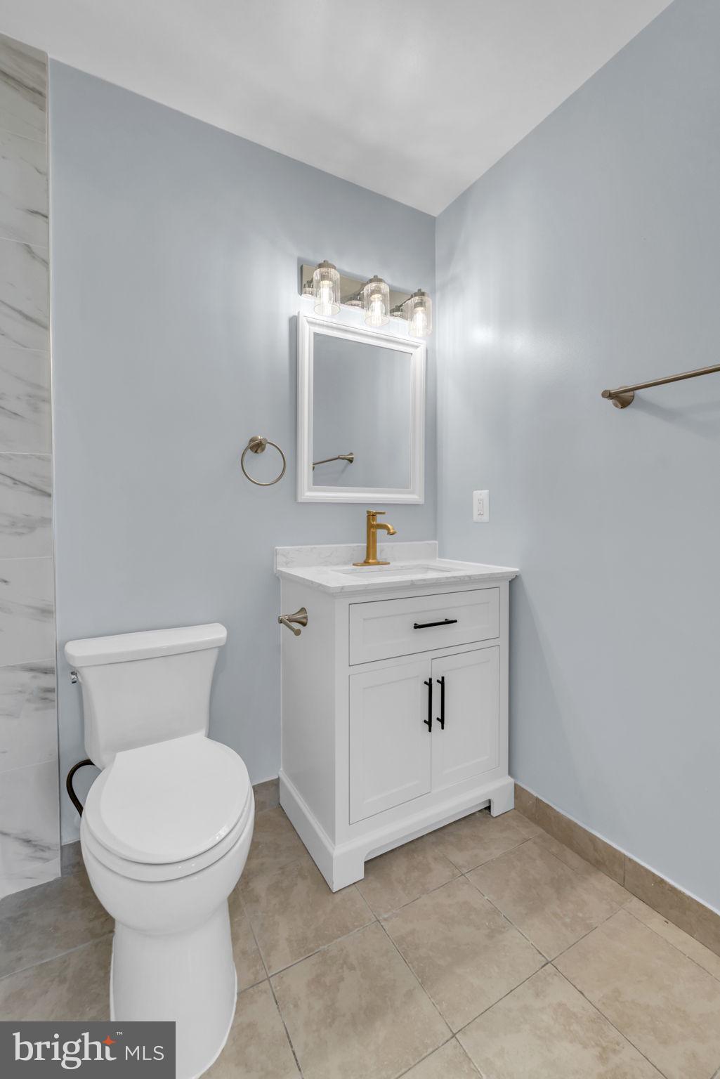 13314 Apgar Place Herndon, VA 20170 - Photo 25 of 39 a bathroom with a toilet sink and mirror