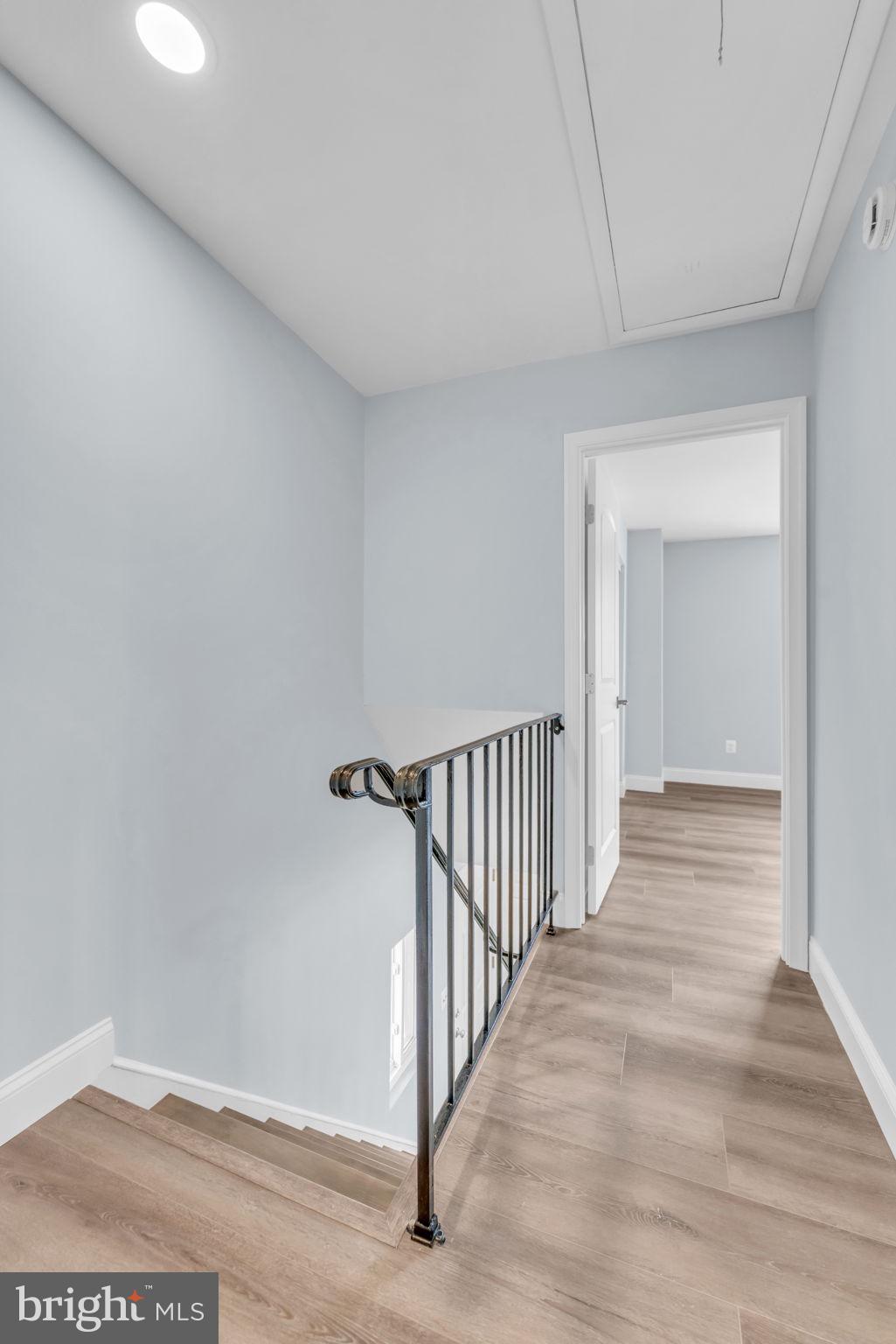 13314 Apgar Place Herndon, VA 20170 - Photo 27 of 39 a view of a hallway with wooden floor