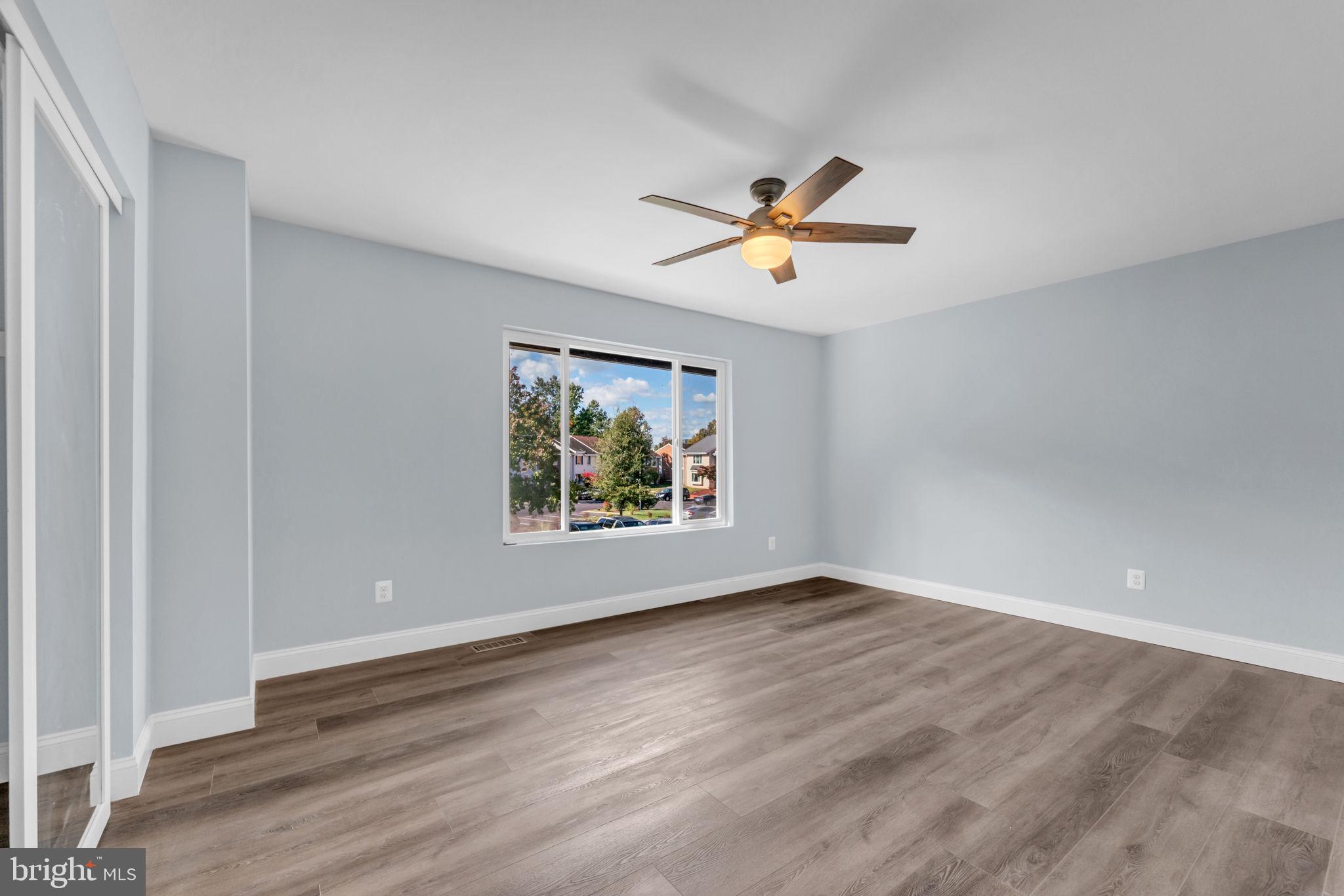 13314 Apgar Place Herndon, VA 20170 - Photo 28 of 39 an empty room with wooden floor and window
