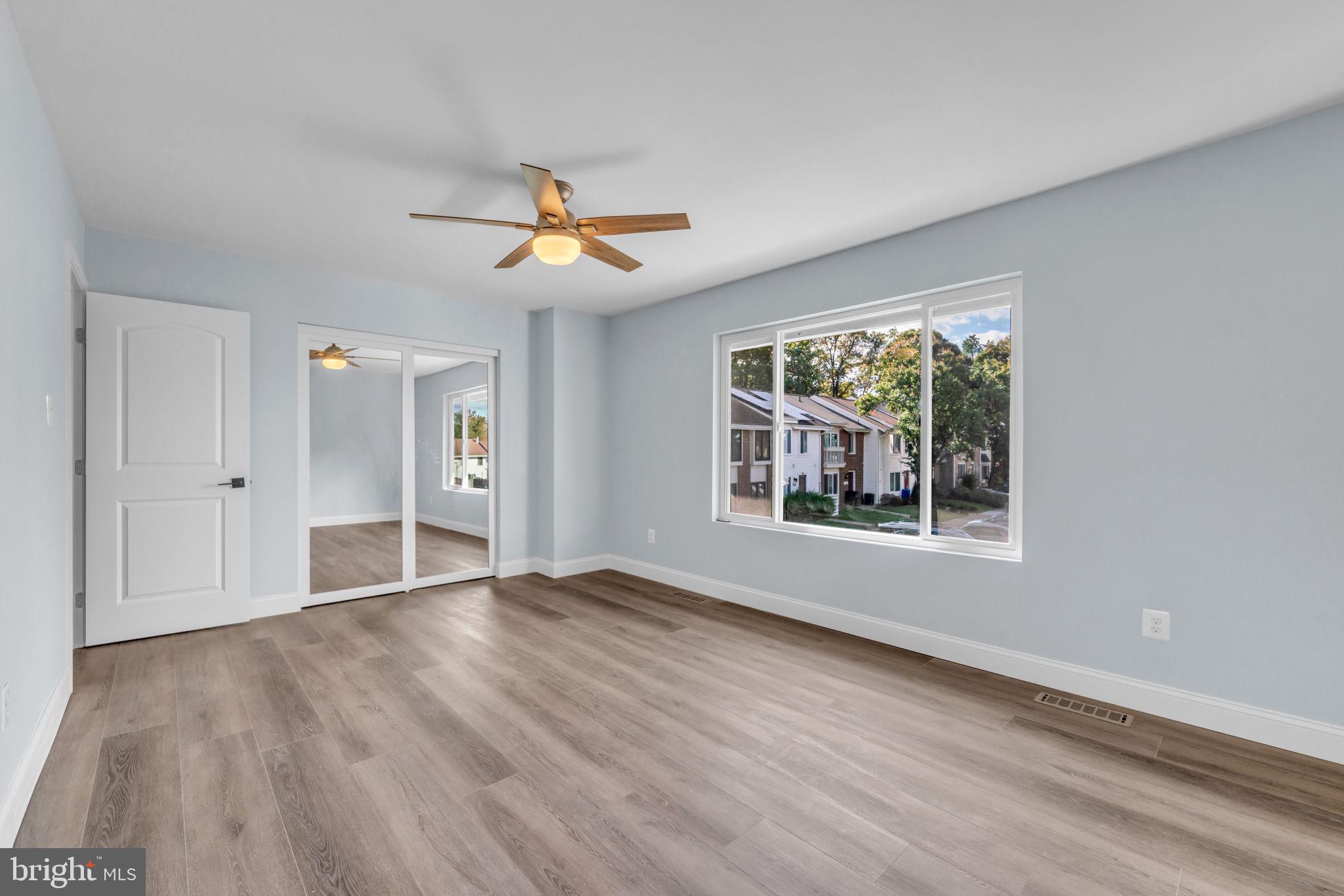13314 Apgar Place Herndon, VA 20170 - Photo 30 of 39 a view of an empty room with a window and wooden floor