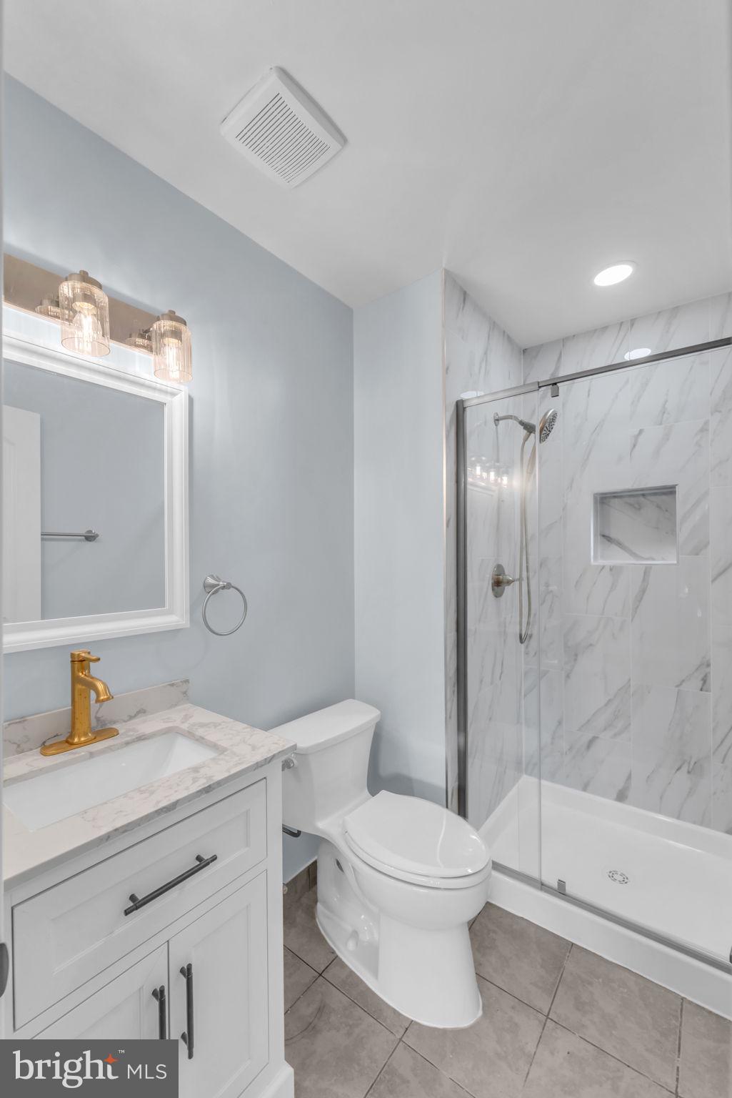 13314 Apgar Place Herndon, VA 20170 - Photo 33 of 39 a bathroom with a toilet sink and shower