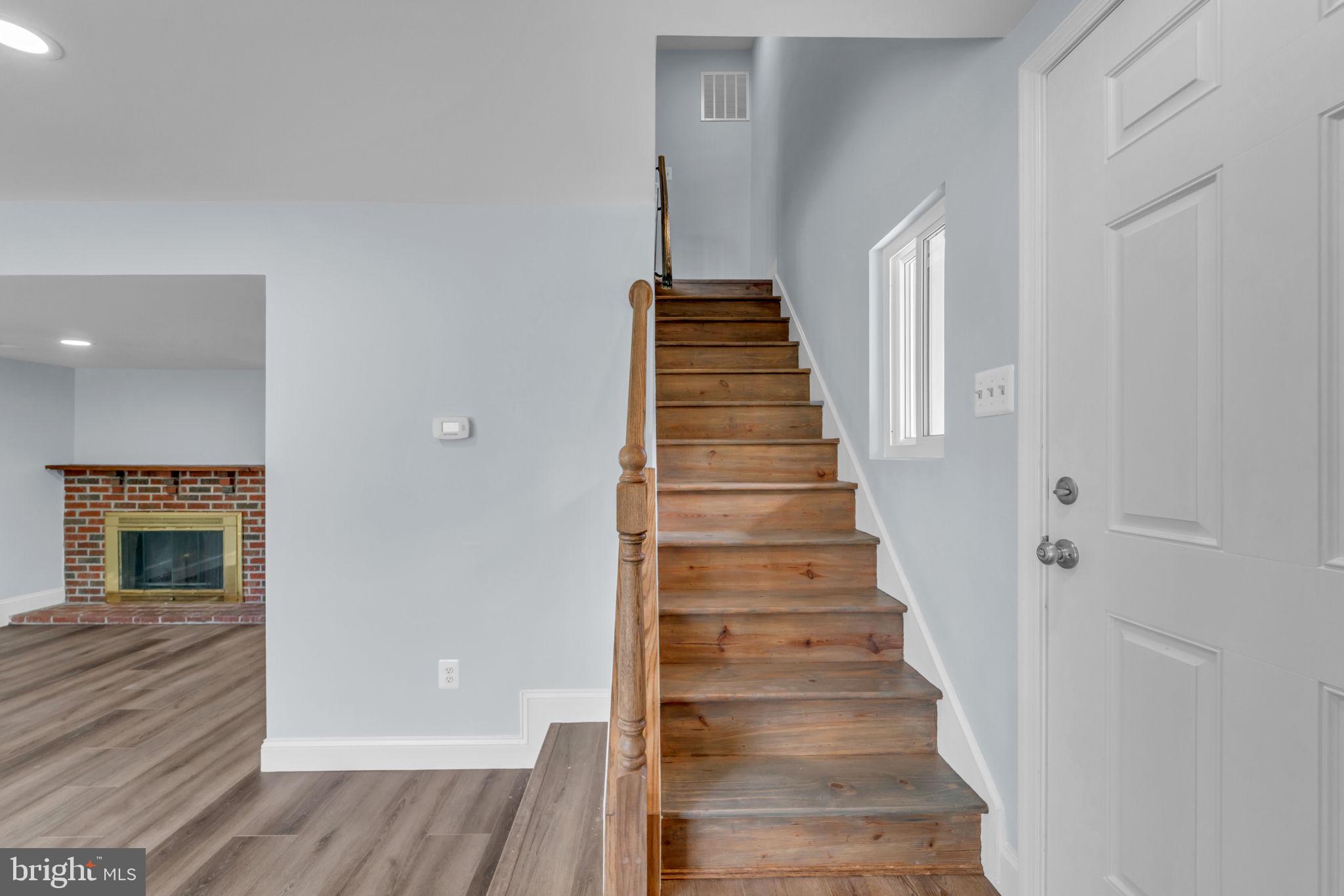 13314 Apgar Place Herndon, VA 20170 - Photo 4 of 39 a view of entryway and hall with wooden floor