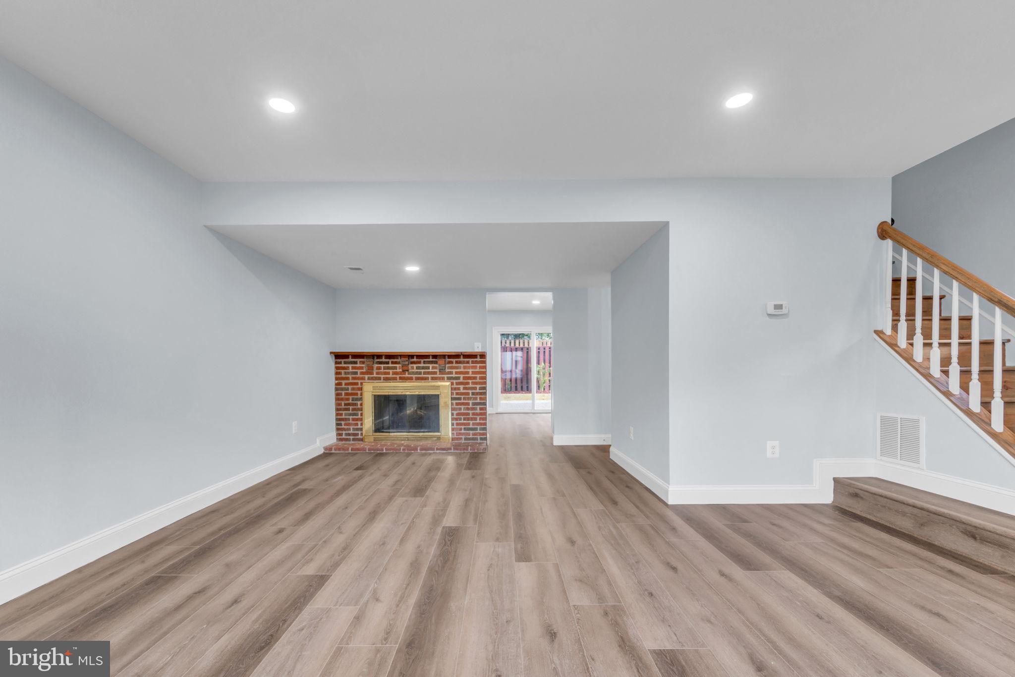 13314 Apgar Place Herndon, VA 20170 - Photo 7 of 39 a view of a livingroom with wooden floor