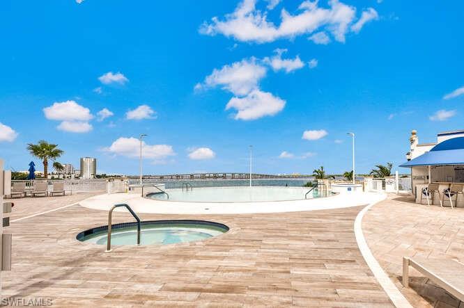 2745 First Street, Unit 104 Fort Myers, FL 33916 - Photo 29 of 39 View of swimming pool with a community hot tub