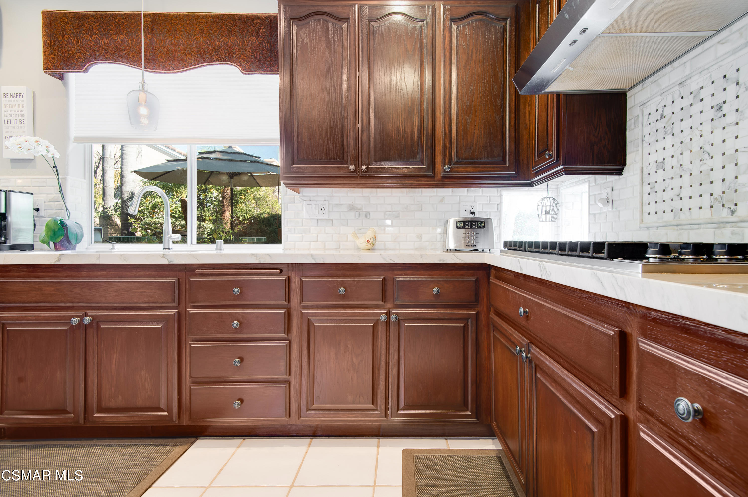 4348 Timberdale Road Moorpark, CA 93021 - Photo 11 of 35 a kitchen with a sink and cabinets