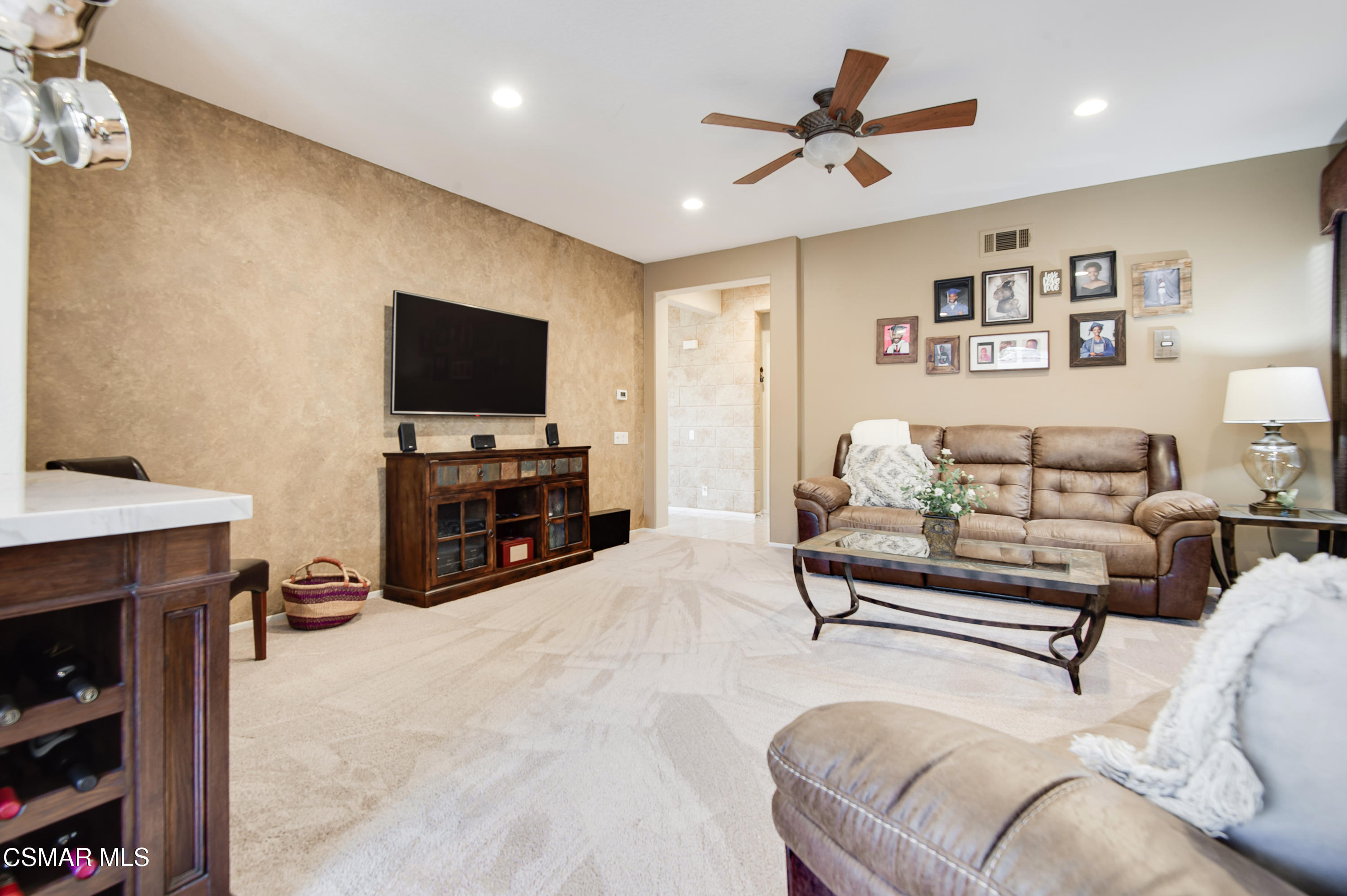 4348 Timberdale Road Moorpark, CA 93021 - Photo 15 of 35 a living room with furniture and a flat screen tv