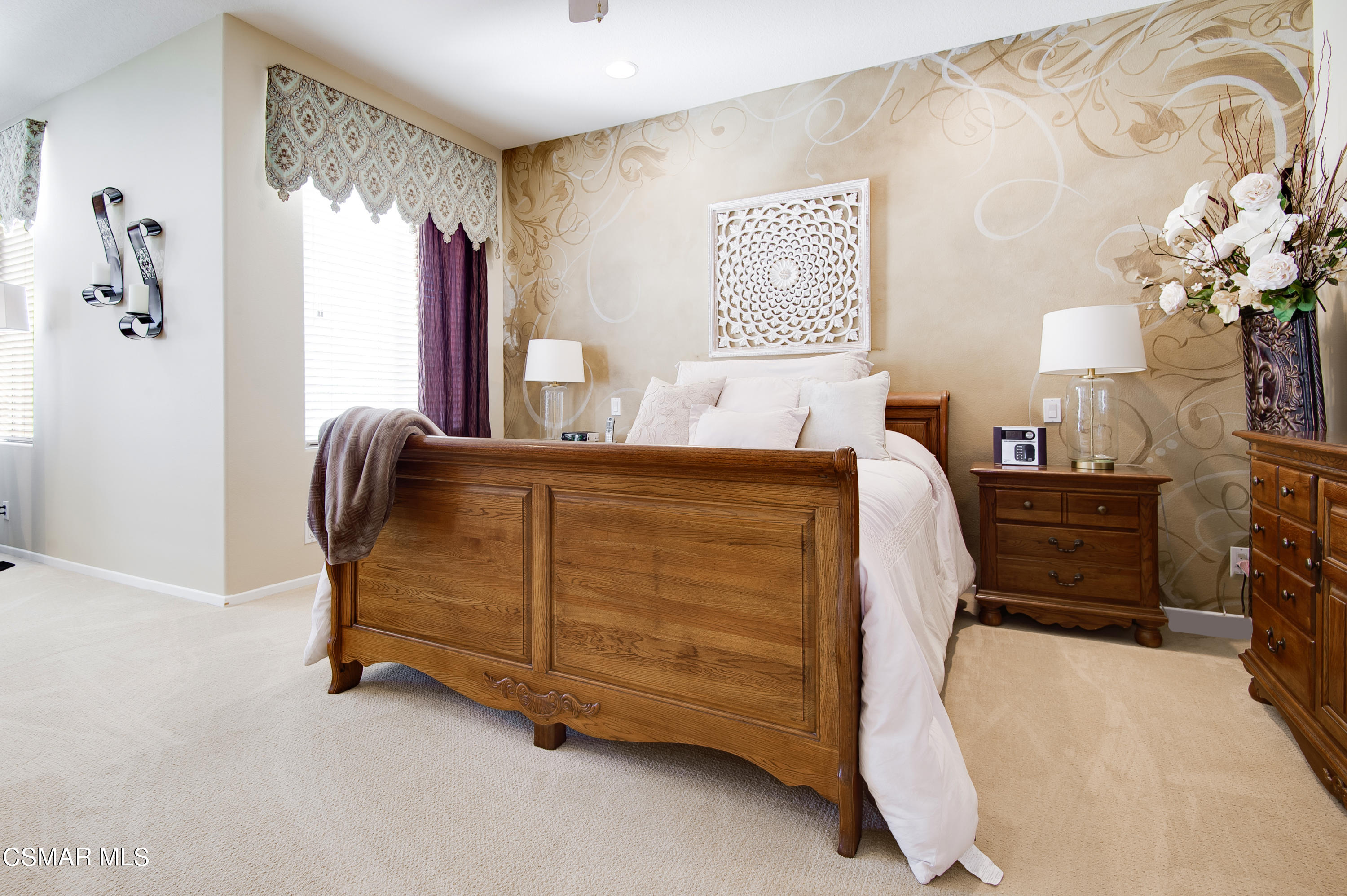 4348 Timberdale Road Moorpark, CA 93021 - Photo 19 of 35 a bedroom with a bed and a chandelier