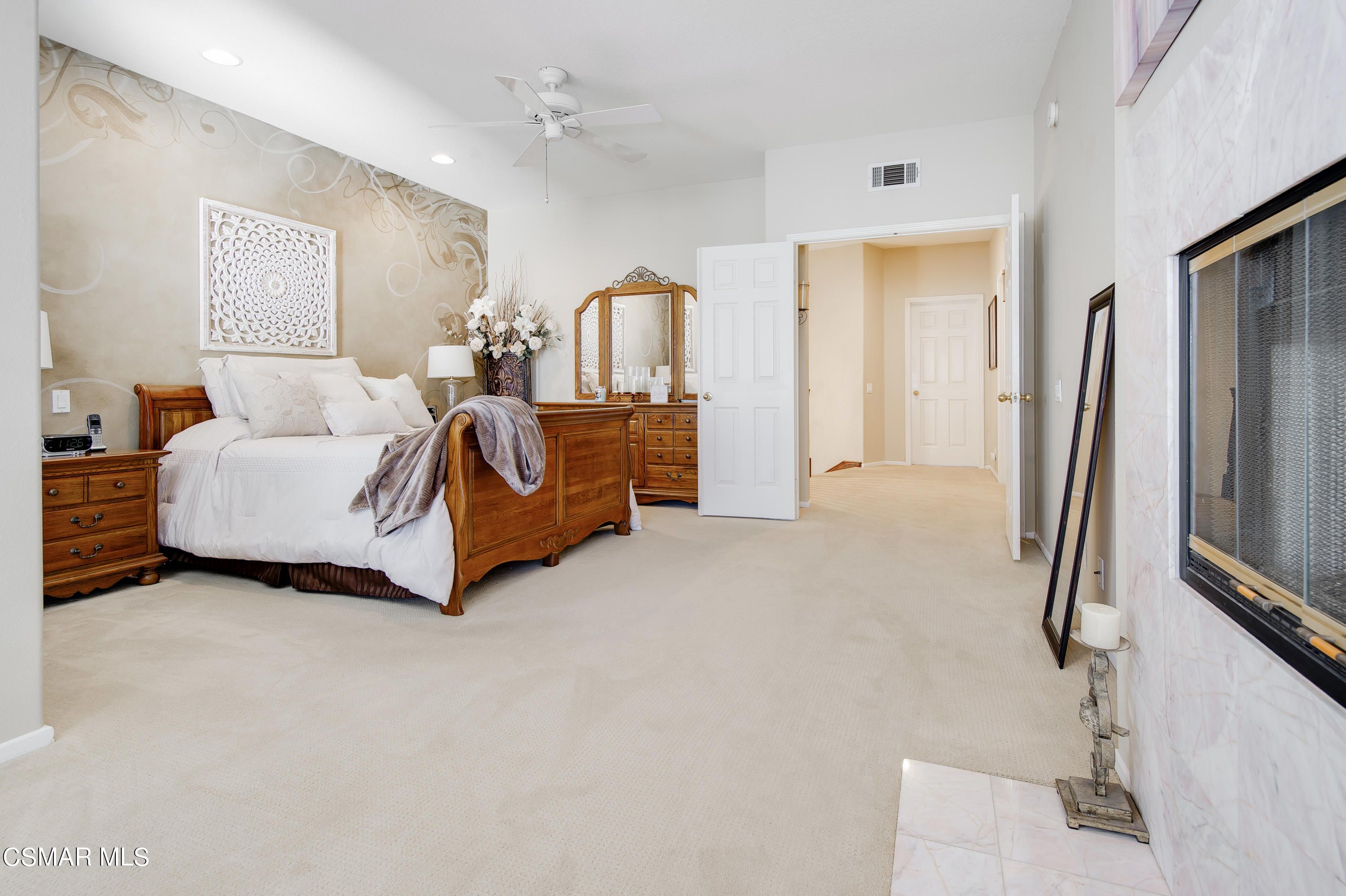 4348 Timberdale Road Moorpark, CA 93021 - Photo 20 of 35 a spacious bedroom with a bed and a flat screen television