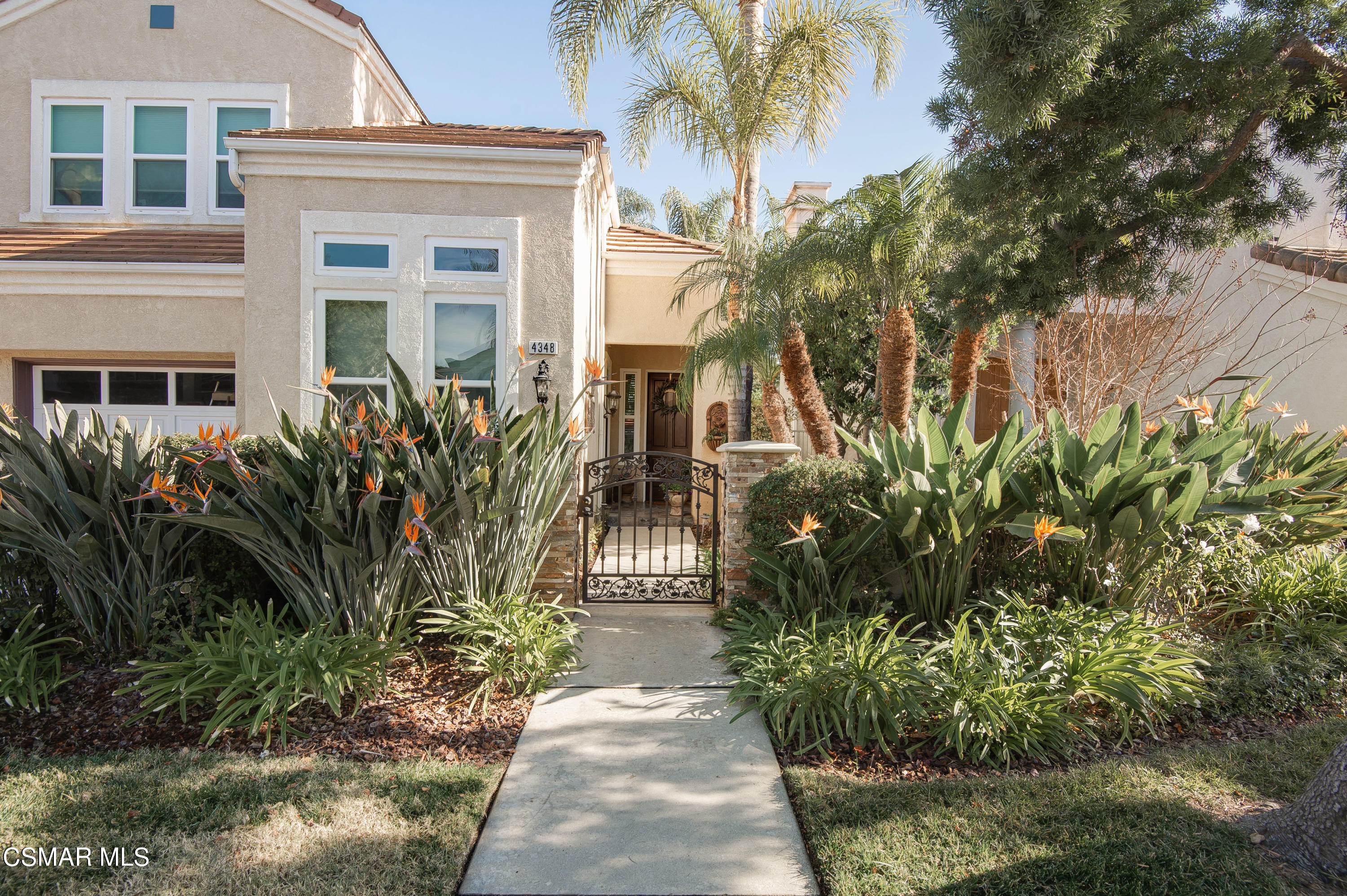 4348 Timberdale Road Moorpark, CA 93021 - Photo 3 of 35 a front view of a house with a garden