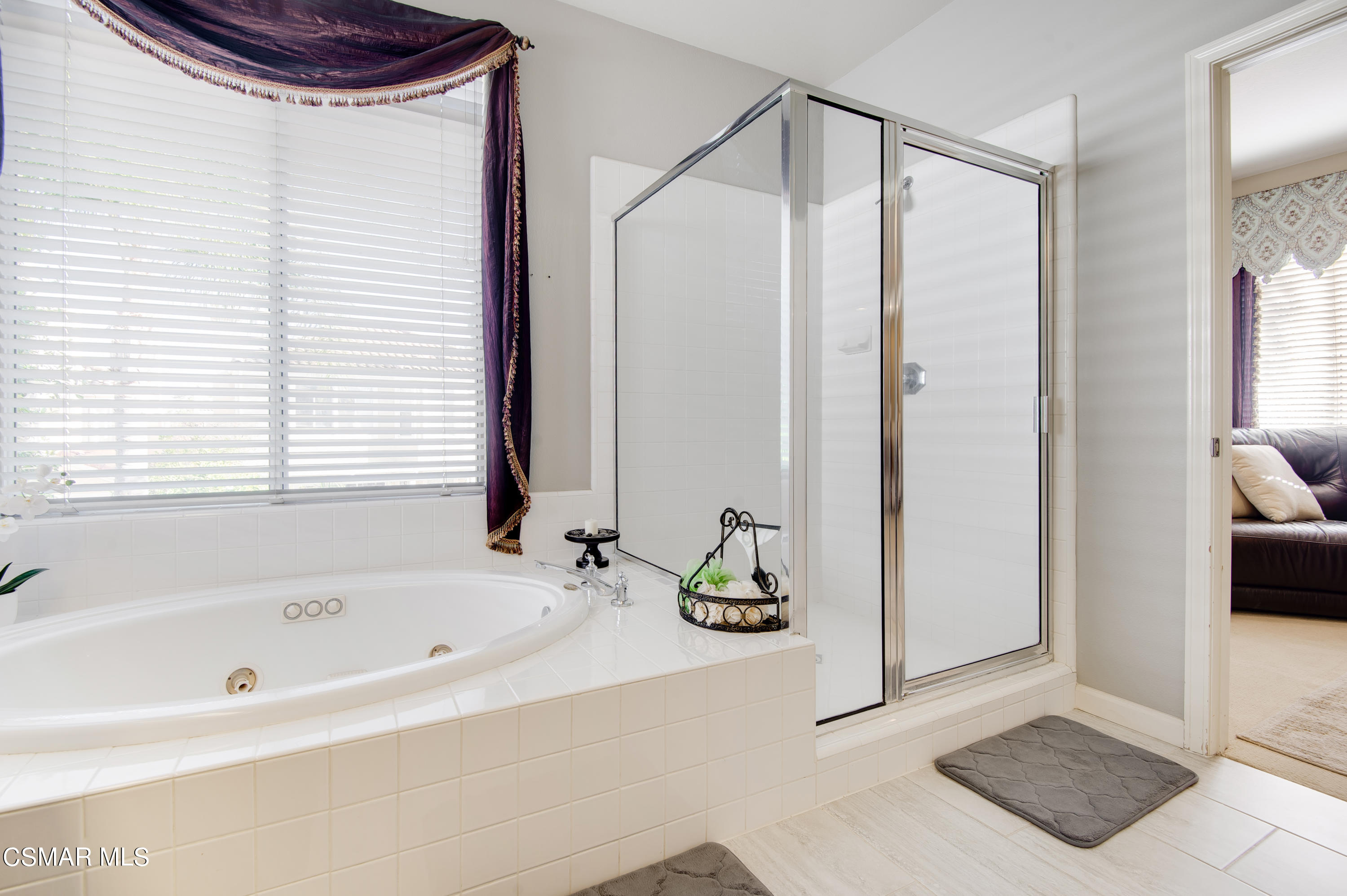 4348 Timberdale Road Moorpark, CA 93021 - Photo 23 of 35 a bathroom with a bathtub and a shower