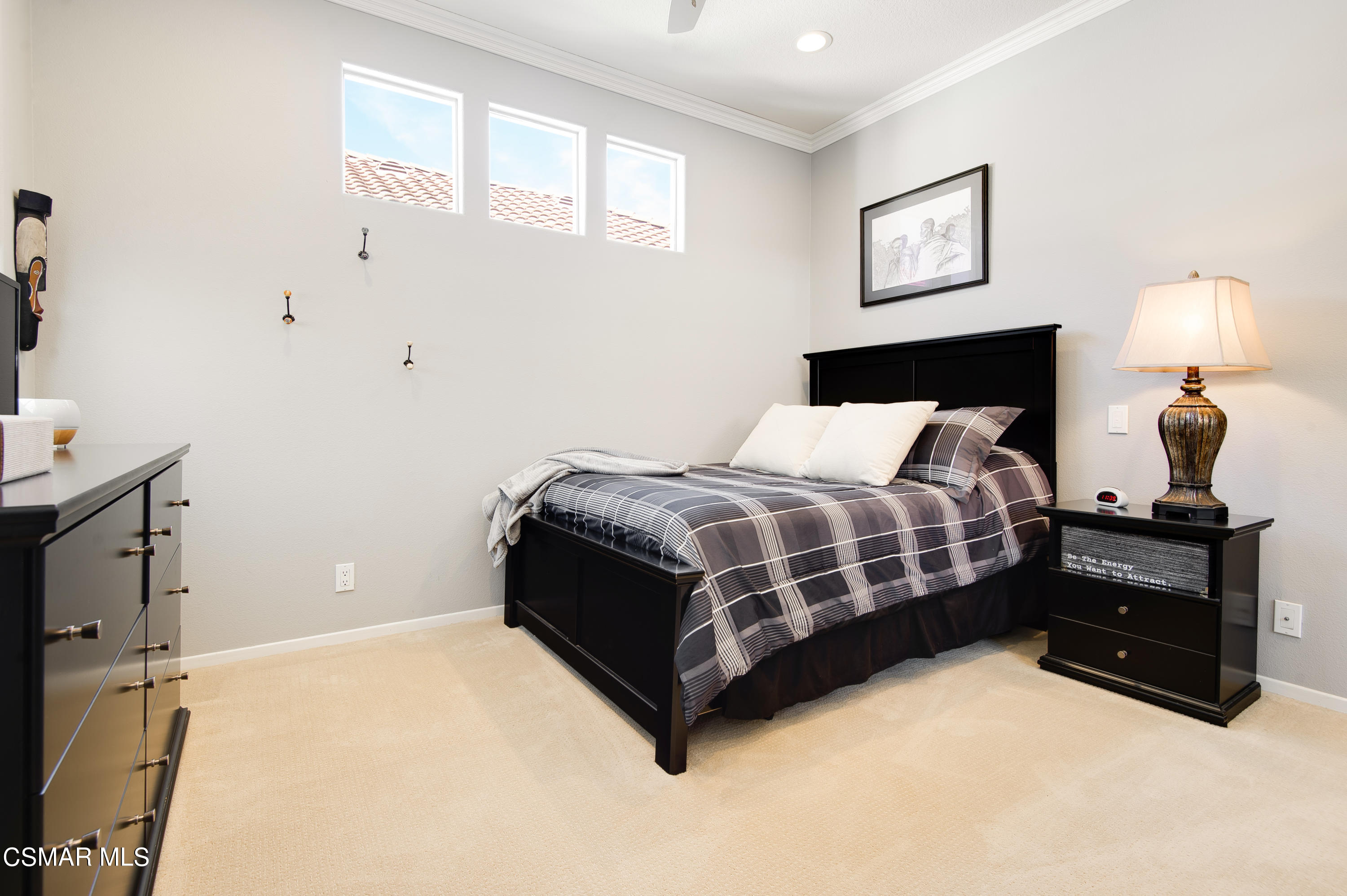 4348 Timberdale Road Moorpark, CA 93021 - Photo 24 of 35 a bedroom with a bed lamp and a window