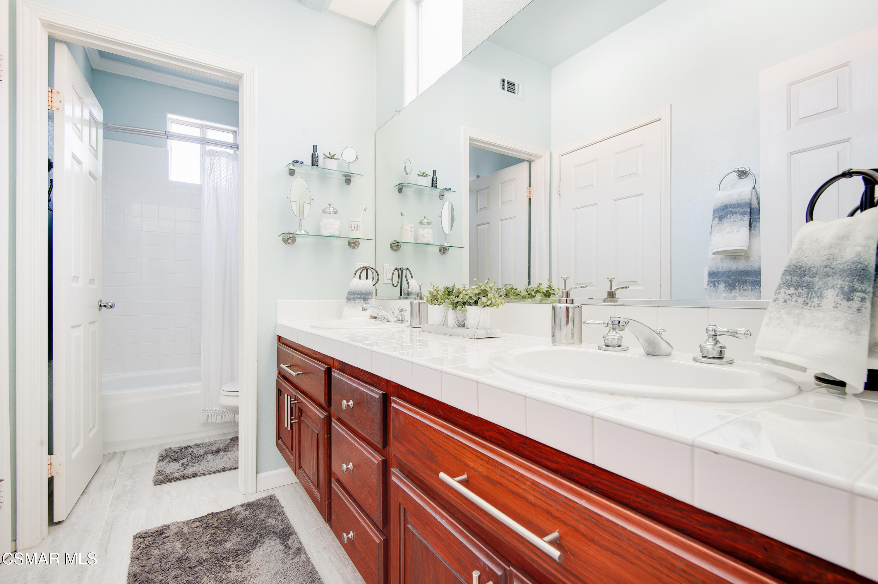 4348 Timberdale Road Moorpark, CA 93021 - Photo 26 of 35 a spacious bathroom with double vanity sink and a mirror