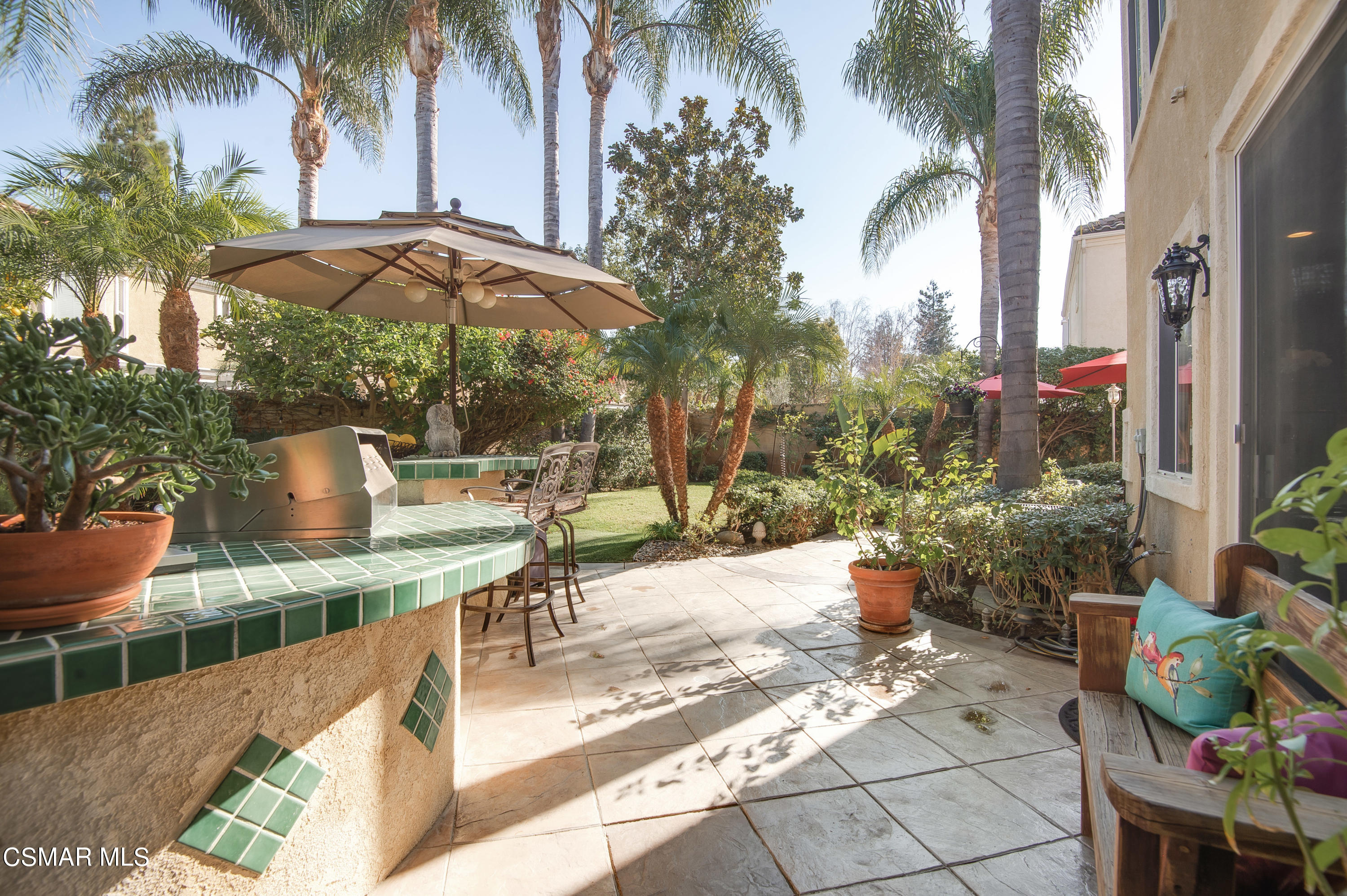 4348 Timberdale Road Moorpark, CA 93021 - Photo 30 of 35 a view of a patio with couches and table under an umbrella