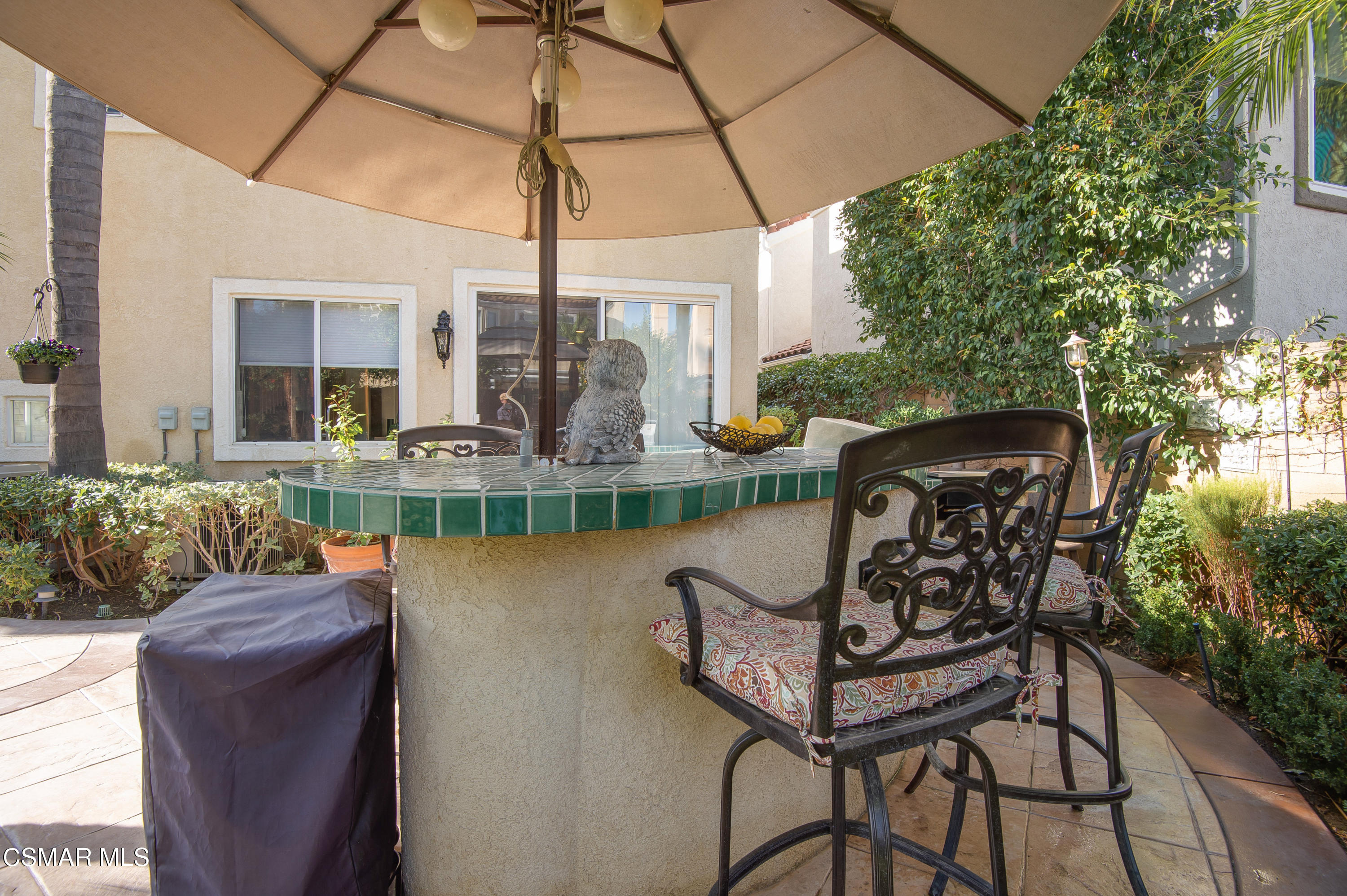 4348 Timberdale Road Moorpark, CA 93021 - Photo 31 of 35 a view of a chairs and table in the patio with a lake view