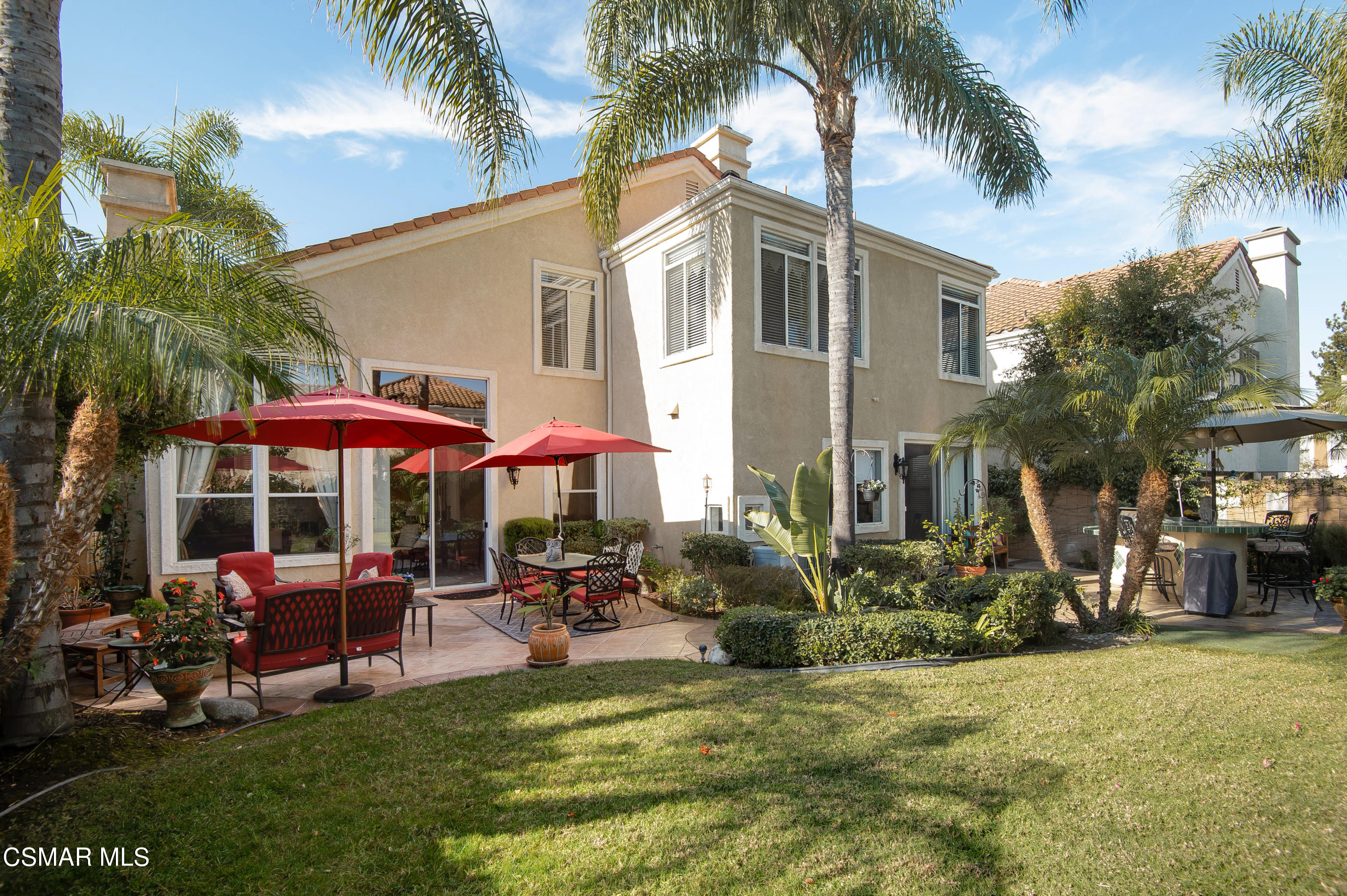 4348 Timberdale Road Moorpark, CA 93021 - Photo 32 of 35 a patio with a table and chairs under an umbrella