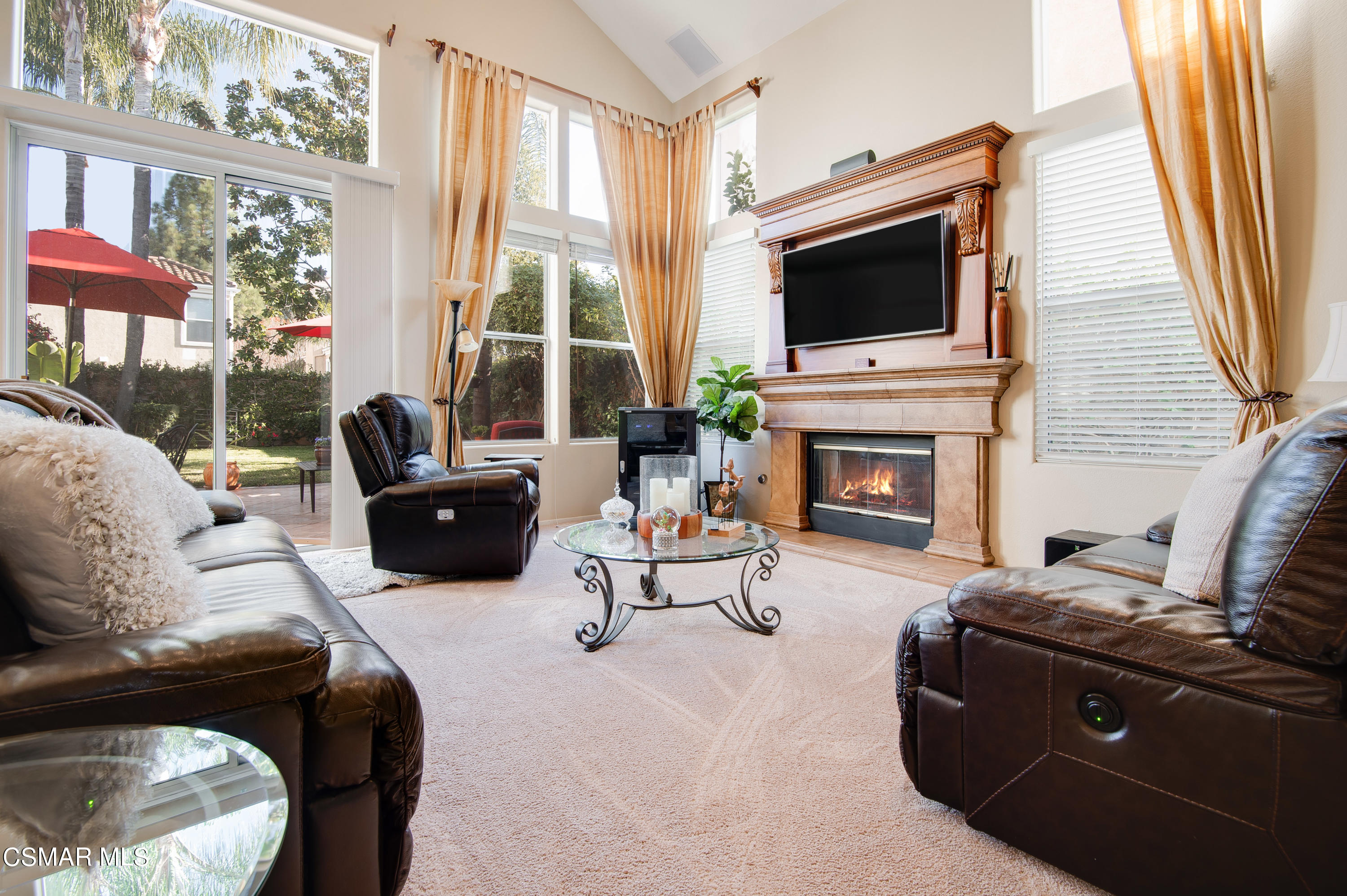 4348 Timberdale Road Moorpark, CA 93021 - Photo 6 of 35 a living room with fireplace furniture and a flat screen tv