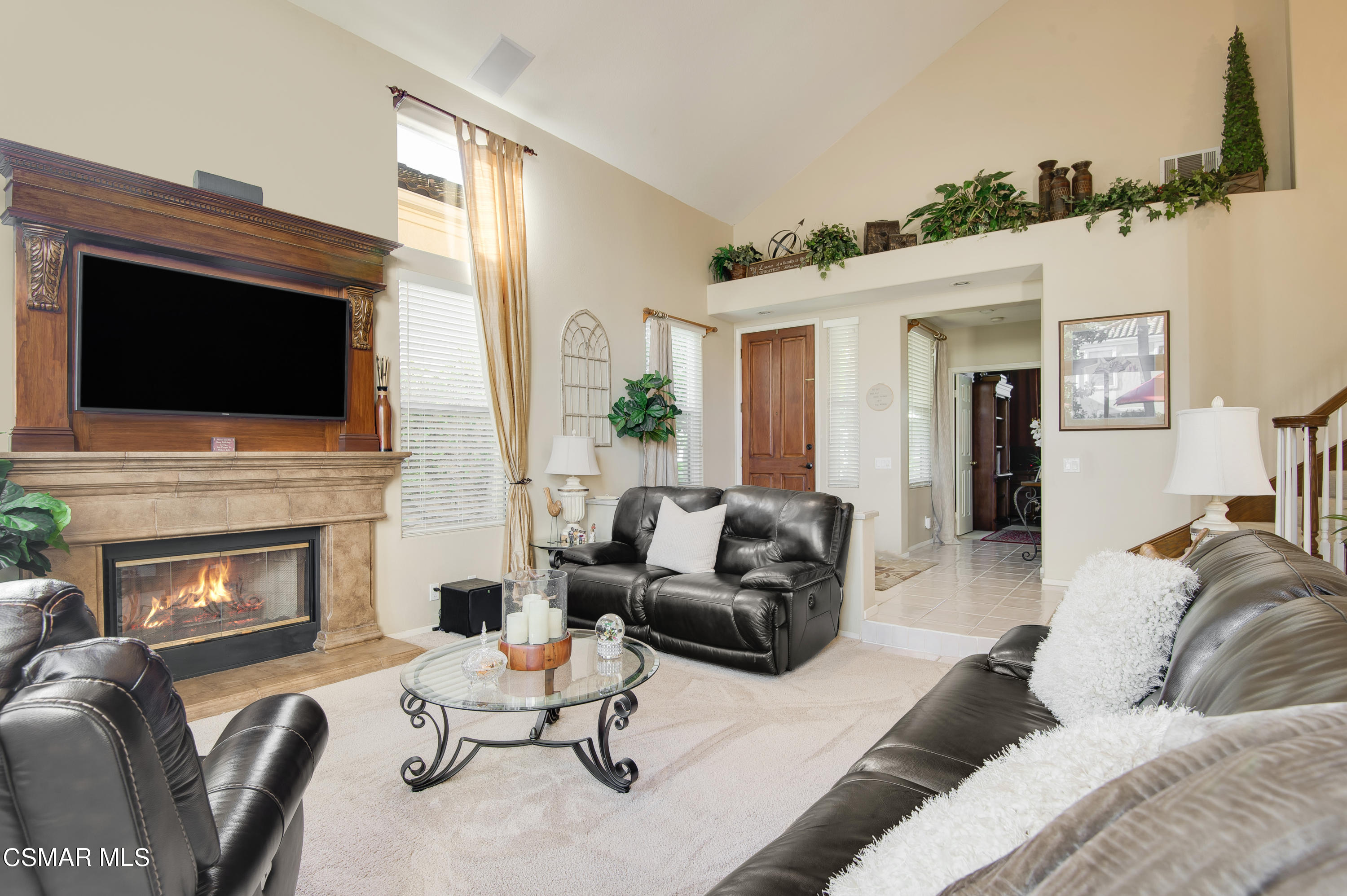 4348 Timberdale Road Moorpark, CA 93021 - Photo 7 of 35 a living room with furniture fireplace and flat screen tv