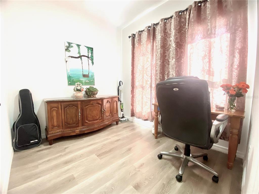 9429 Northcliffe Boulevard Spring Hill, FL 34606 - Photo 22 of 26 a view of a workspace with furniture and a window