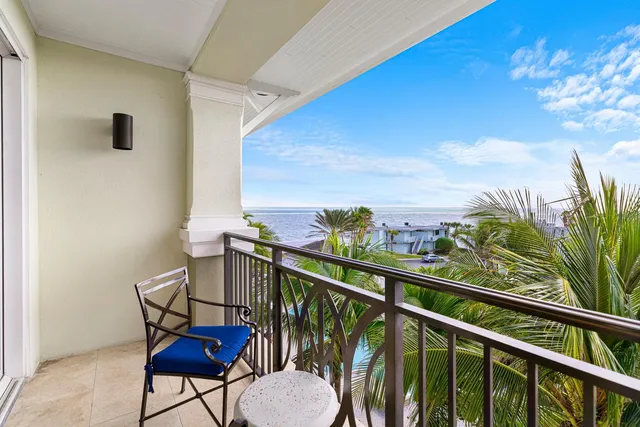 a view of a balcony with furniture