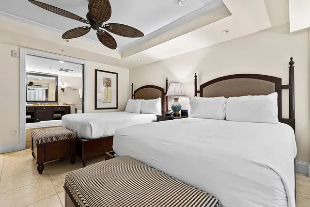 a bedroom with bed and a chandelier