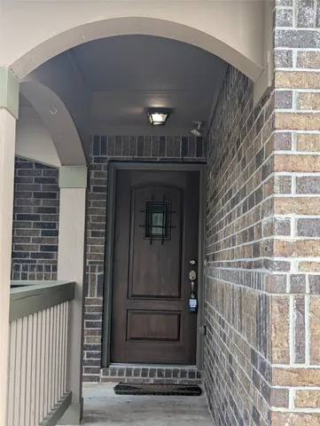 a view of entryway with a door and wooden floor