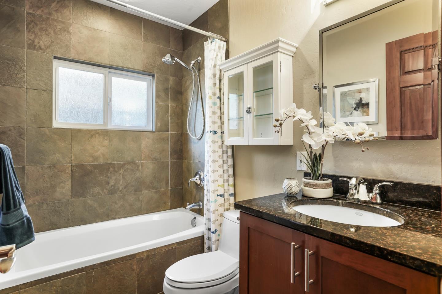 2417 Johnson Place Santa Clara, CA 95050 - Photo 19 of 30 a bathroom with a granite countertop sink toilet and shower