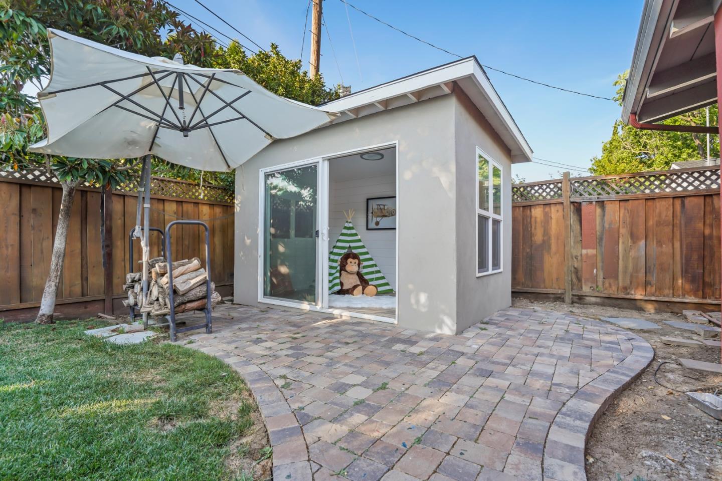 2417 Johnson Place Santa Clara, CA 95050 - Photo 28 of 30 a view of a patio with a table and chairs under an umbrella