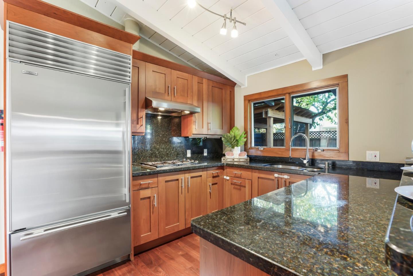 2417 Johnson Place Santa Clara, CA 95050 - Photo 9 of 30 a kitchen with stainless steel appliances granite countertop a refrigerator a stove and a sink with wooden floor