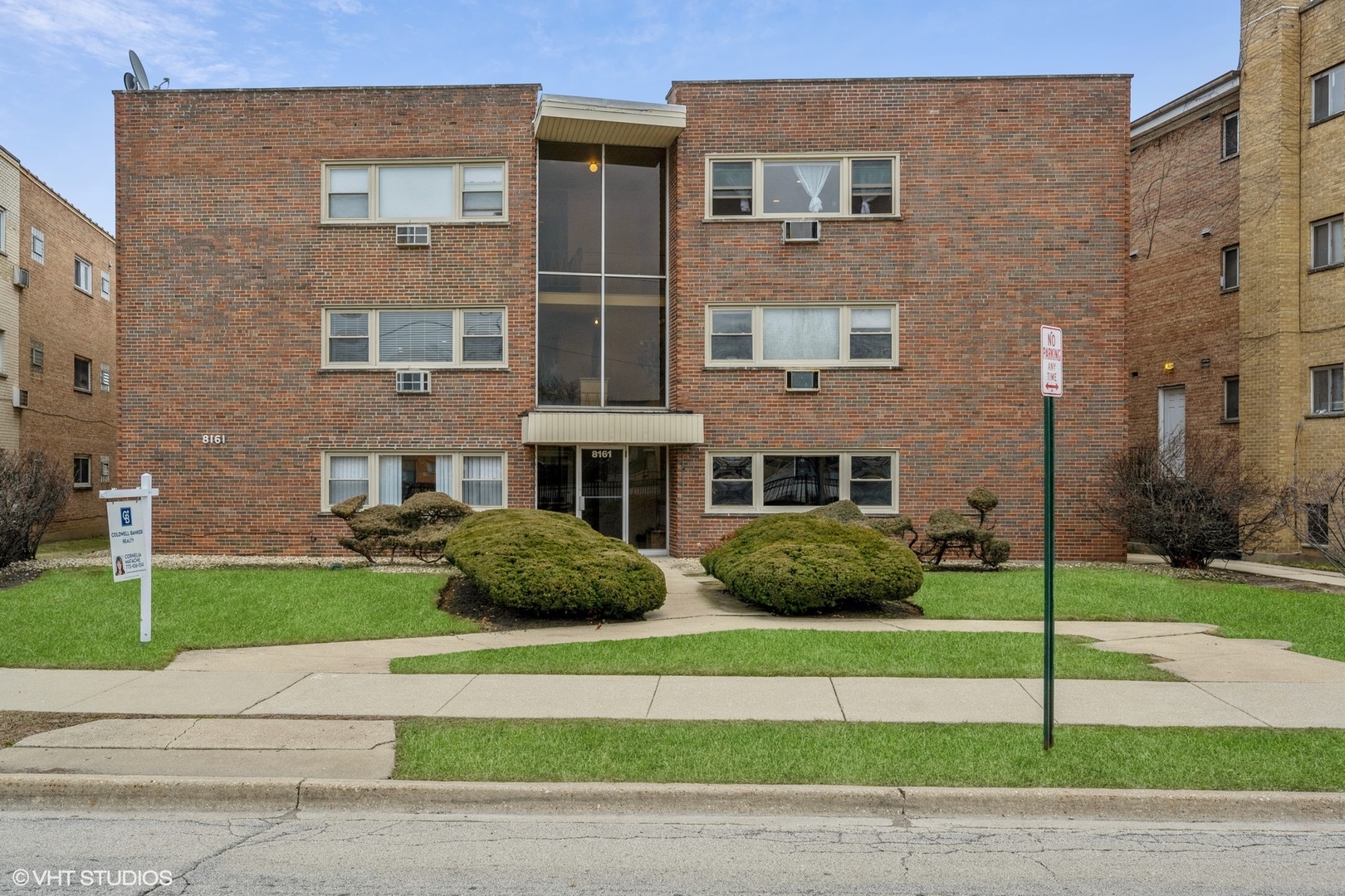 8161 Niles Center Road, Unit 3A Skokie, IL 60077 - Photo 1 of 12 a view of a brick building next to a yard