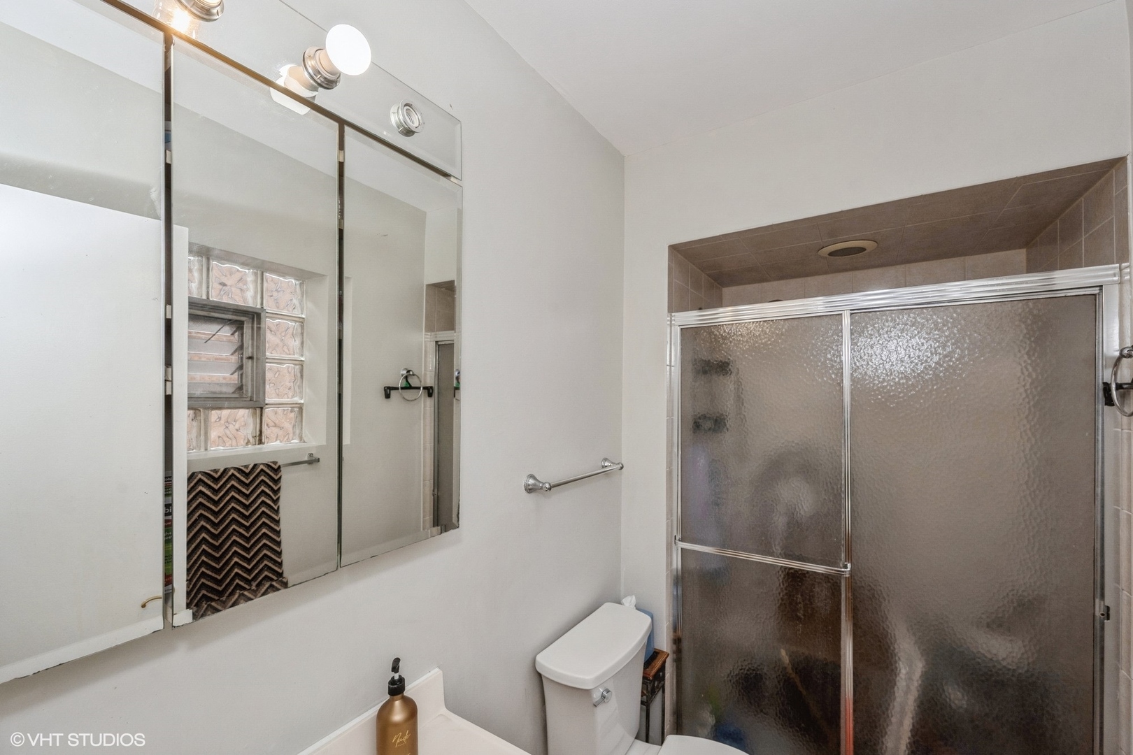 8161 Niles Center Road, Unit 3A Skokie, IL 60077 - Photo 11 of 12 a bathroom with a shower and a toilet