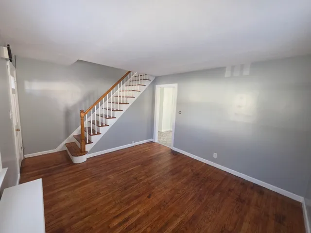 a view of entryway with wooden floor