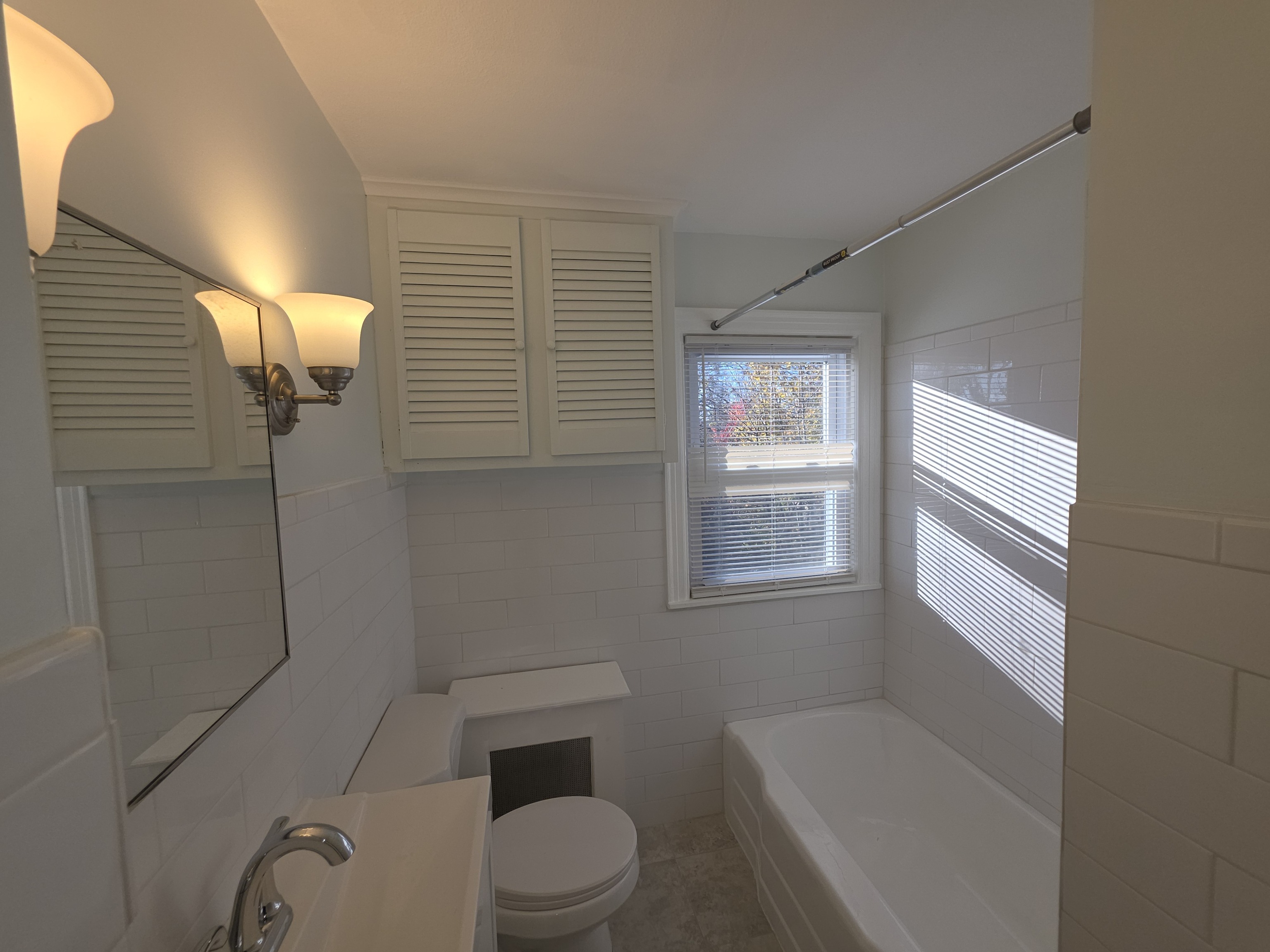 15 Keller Avenue Enfield, CT 06082 - Photo 7 of 13 a white toilet sitting next to a bathroom sink and tub